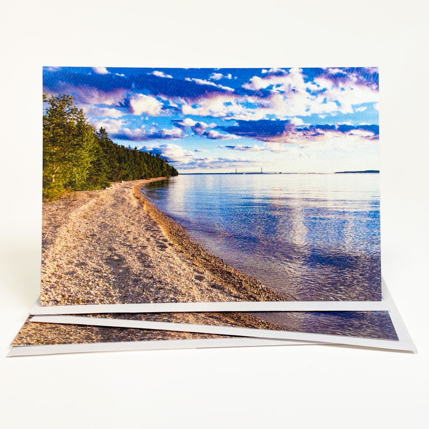 Blank greeting card featuring a photograph of the Mackinac Bridge by local photographer Jennifer Wohletz of Mackinac Island, Michigan. Open the card to discover another photo inside! May be customized for Mackinac Island wedding invitations, announcements and thank you notes. Made in Michigan.