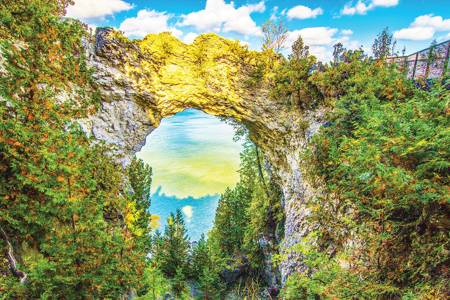 Mackinac’s most iconic scene, Arch Rock, is captured by Jennifer Wohletz with its shadow in the lake far below as the sun sets. 