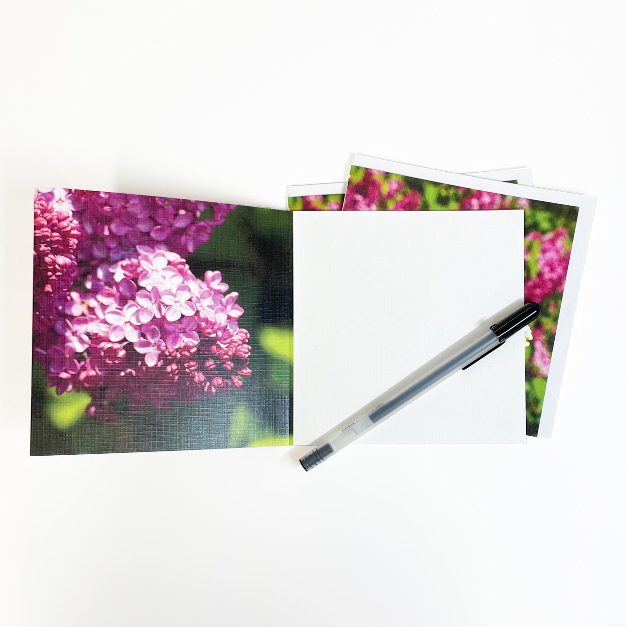 Lilacs create a canopy of fragrance on Mackinac Island in June that's a delight to your senses.  Open the card to reveal an image of their delicate petals that's sure to make you feel as if you can smell the lilacs! Lilacs symbolize the joy of youth. Photography by Jennifer Wohletz.  This casually elegant card is meant to be shared or displayed as a work of art.  